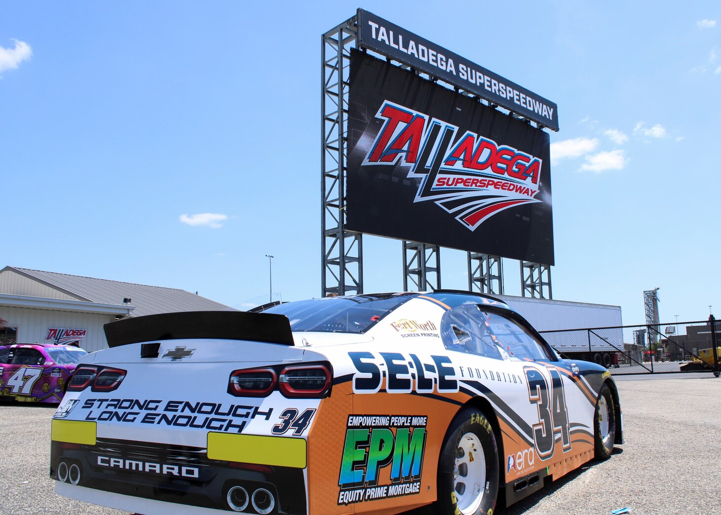 Navy Reserve Sailor and professional NASCAR driver, Lt. Cmdr. Jesse Iwuji, prepares to race at Talladega Superspeedway on April 22, 2022.