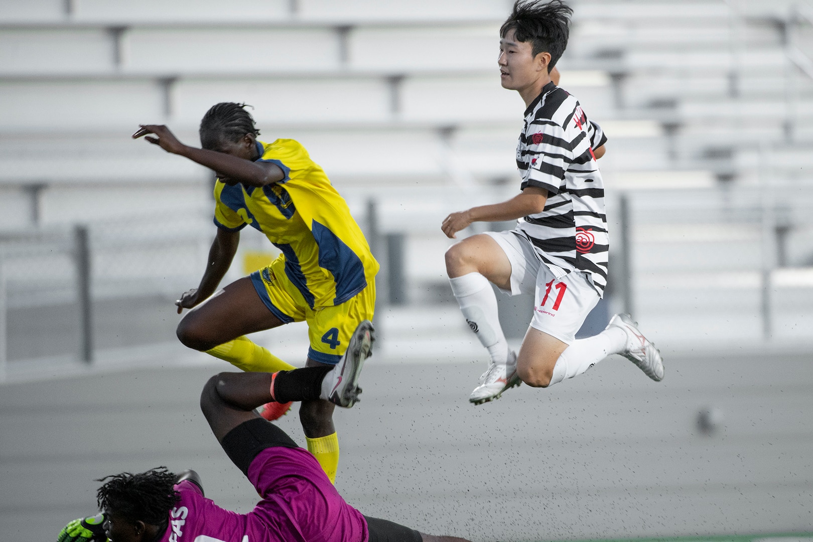 South Korea’s Min Soo Kim leaps over Mali goalkeeper Fatoumata Karentao after scoring a goal during the 13th CISM (International Military Sports Council) World Military Women’s Football Championship in Meade, Washington July 14, 2022. (DoD photo by EJ Hersom)