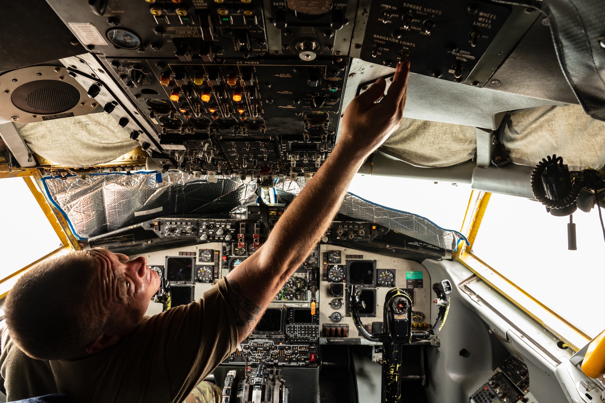 U.S. Air Force Col. Randy D. Schwinler, Commander 379th Expeditionary Maintenance Group, Al Udeid Air Base, Qatar, conducts a pre-flight check on a KC-135, July 9, 2022. Schwinler worked during this process to test the functionality of cockpit controls both inside and outside of the Aircraft. (U.S. Air Force photo by Staff Sgt. Dana Tourtellotte)