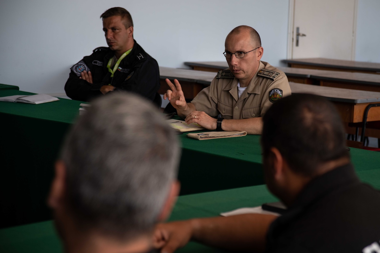 Bulgarian Navy Capt. Daniel Todorov, commander, Auxiliary Ships Squadron, asks questions about U.S. floating mine response procedures during the knowledge exchange portion of exercise Breeze 2022, July 14. Breeze 2022 enhances interoperability among Bulgaria and participating nations, with an emphasis on anti-submarine warfare, search and rescue, force protection/anti-terrorism operations, maritime interdiction operations, and anti-piracy mission areas.