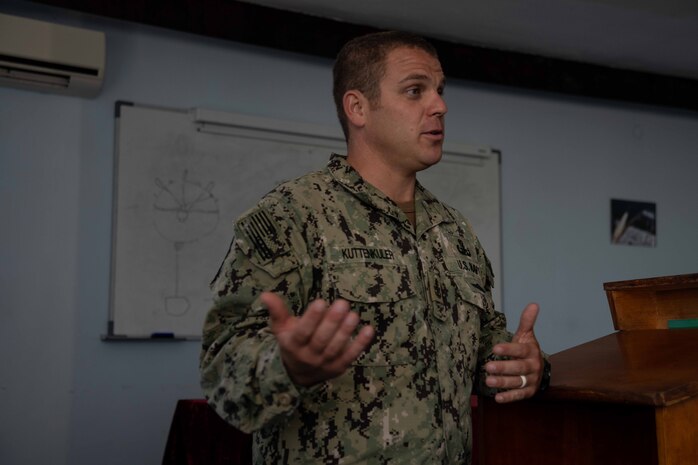 Senior Chief Explosive Ordnance Disposal Matthew Kuttenkuler, assigned to Explosive Ordnance Disposal Mobile Unit (EODMU) 12, delivers a brief on U.S. floating mine response procedures to Bulgarian Sailors as part of a knowledge exchange between the two nations during exercise Breeze 2022, July 14, 2022. Breeze 2022 enhances interoperability among Bulgaria and participating nations, with an emphasis on anti-submarine warfare, search and rescue, force protection/anti-terrorism operations, maritime interdiction operations, and anti-piracy mission areas.