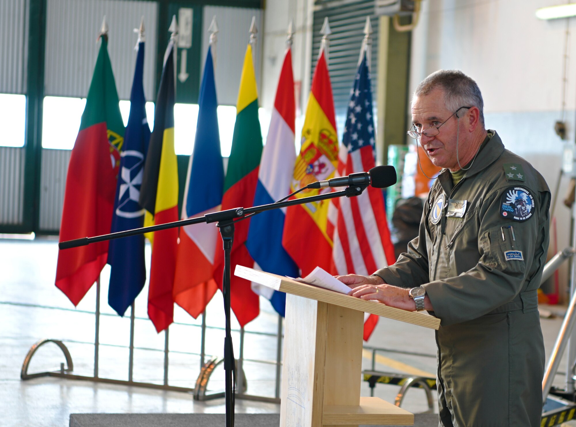person speaking at a podium