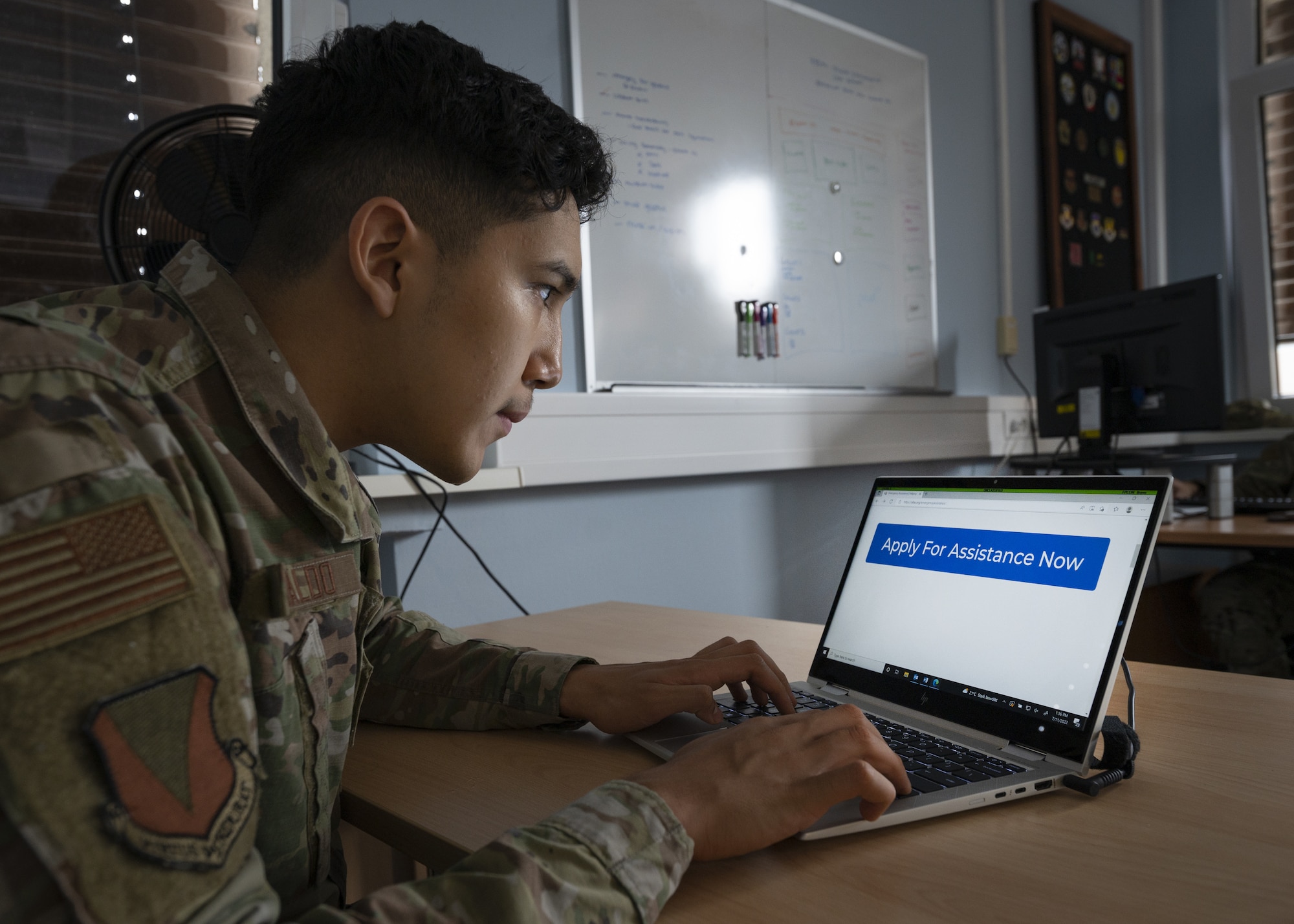 An Airman applies online for Air Force Aid Society assistance at Ramstein Air Base, Germany, July 12, 2022. The new online
application process was put into place to give military members 24-hour access to apply online rather than coming into the
Military and Family Readiness center during the duty day. (U.S. Air Force photo by Senior Airman Andrew Bertain)