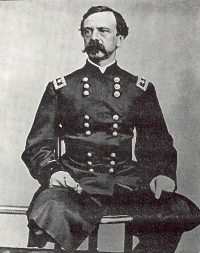 A man with only one leg poses for a photo.
