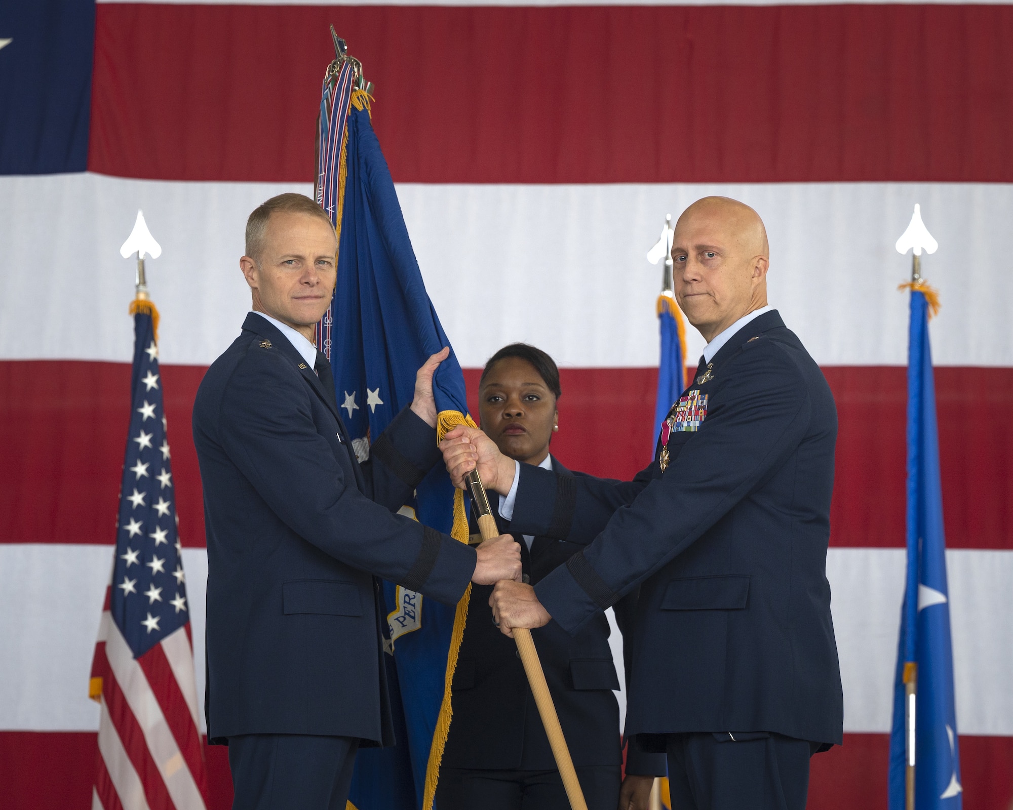 U.S. Air Force Brig. Gen. Josh Olson, outgoing 86th Airlift Wing commander, right, relinquishes command of the 86 AW to Maj. Gen. Derek France, Third Air Force commander, during a change of command ceremony at Ramstein Air Base, Germany, July 15, 2022. Once Olson relinquished command of the 86 AW, he became the director of Global Reach Programs for the Office of the Assistant Secretary of the Air Force for Acquisitions, Technology, and Logistics, at the Pentagon. (U.S. Air Force photo by Senior Airman Andrew Bertain)