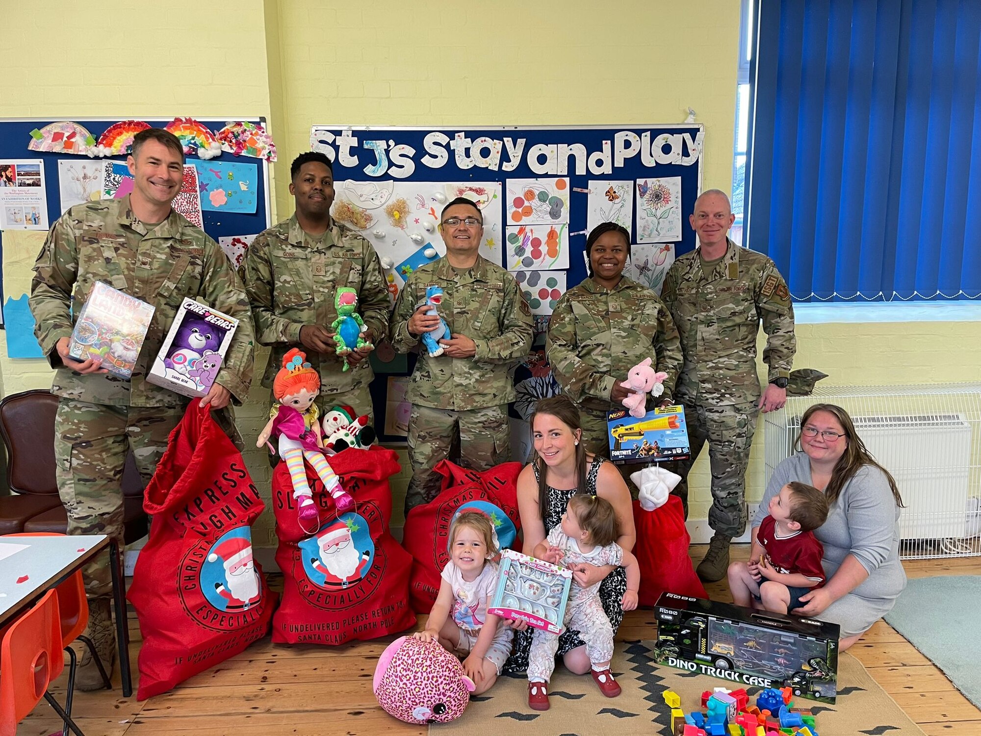 The First Sergeant Council from Royal Air Force Mildenhall, England, visit Beck Row Pre-School for a “Christmas in July” toy drive, July 6, 2022. The First Sergeant Council fundraises and donates through the Angel Tree Project to the local community twice a year, providing toys, clothes and books to children in need. (Courtesy photo)