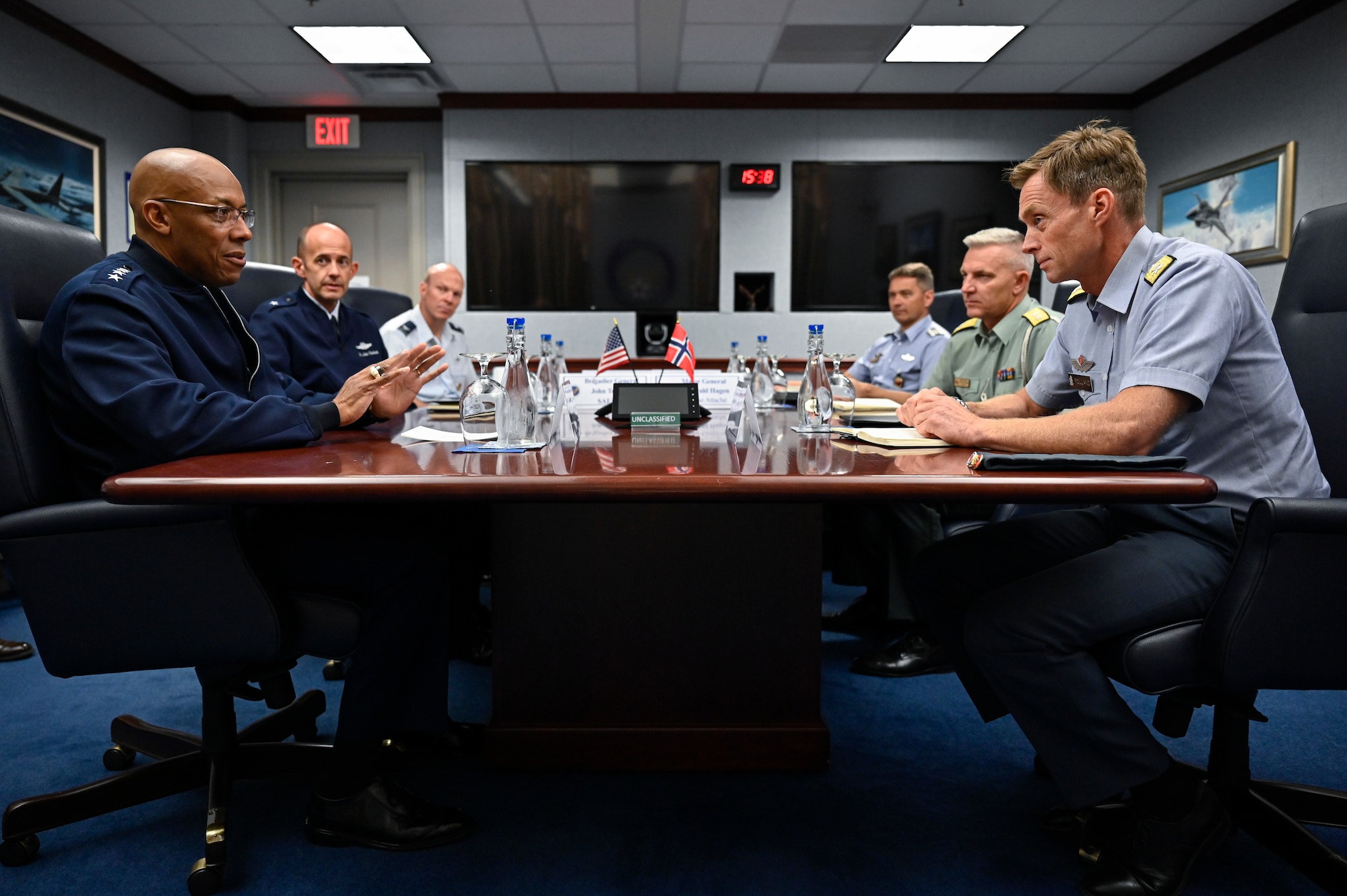 Air Force Chief of Staff Gen. CQ Brown, Jr., left, speaks with Maj. Gen. Rolf Folland, chief of the Royal Norwegian Air Force.