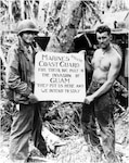 This iconic image from the Battle of Guam testifies to the strong bonds forged between the Marine Corps and the Coast Guard over the course of the Pacific War. (Courtesy of the Coast Guard)