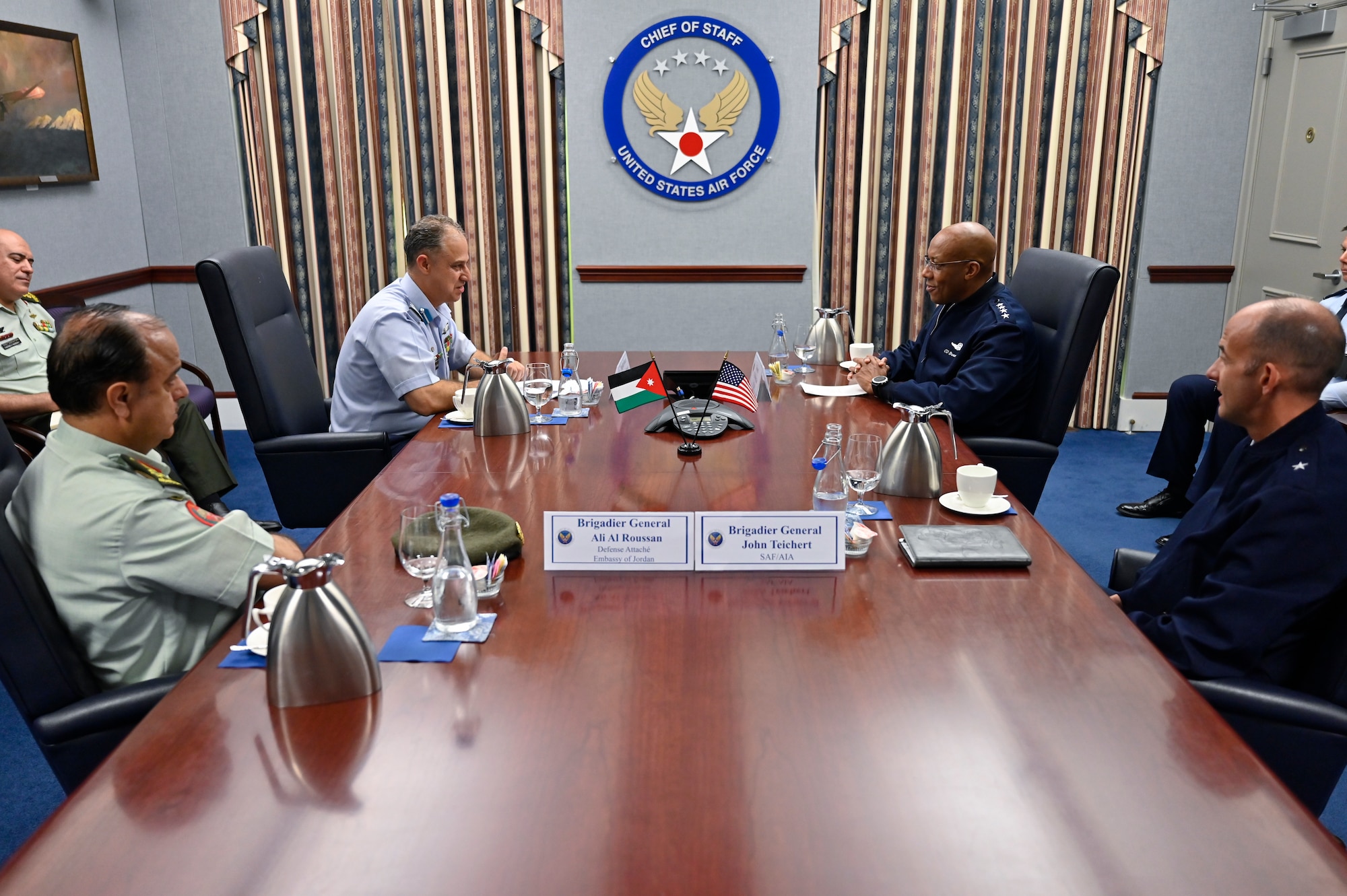Brig. Gen. Mohammad Hiyasat, center left, commander of the Royal Jordanian Air Force, speaks with Air Force Chief of Staff Gen. CQ Brown, Jr.
