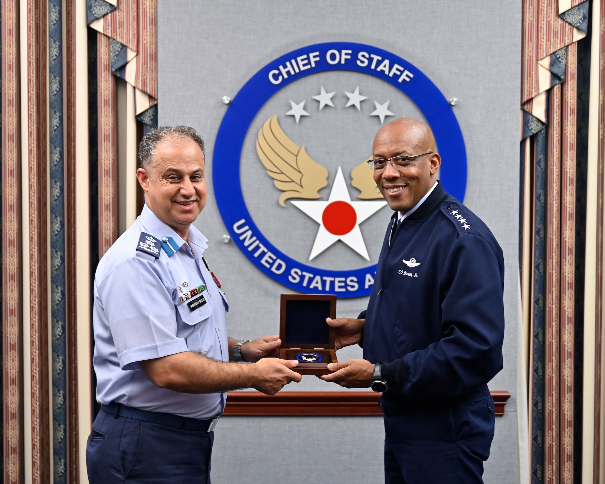 Air Force Chief of Staff Gen. CQ Brown, Jr. poses with Brig. Gen. Mohammad Hiyasat, commander of the Royal Jordanian Air Force.