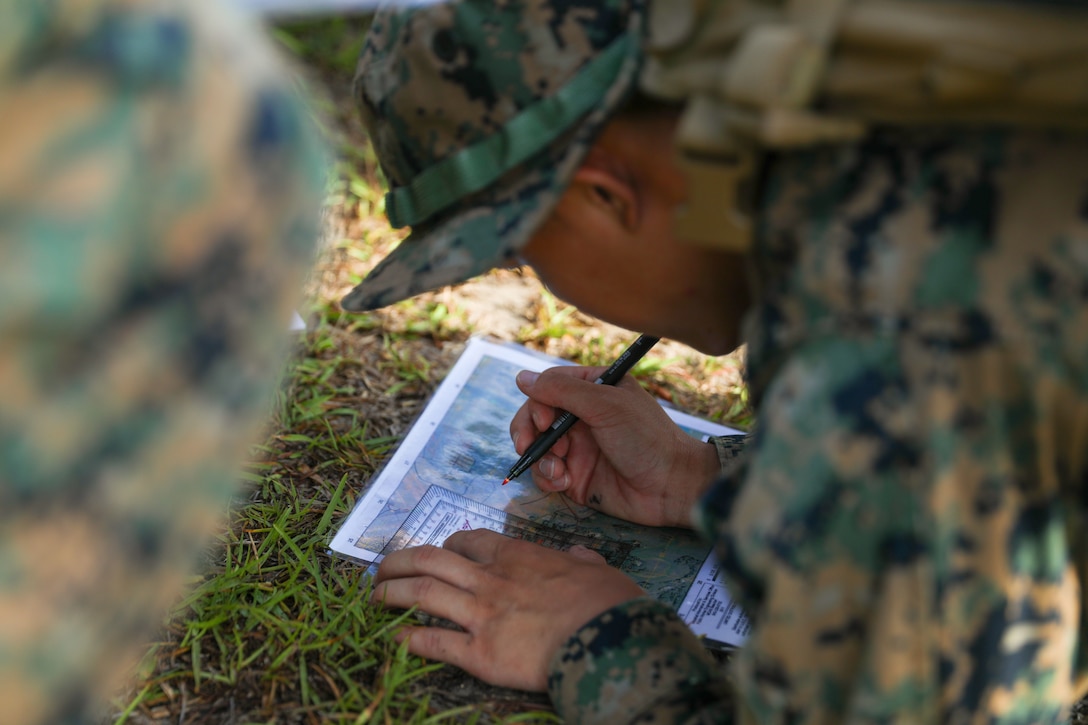 ARE WE THERE YET? 



U.S. Marine Corps Cpl. Koua Thao, inbound non-commissioned officer in charge, Installation Personnel Administration Center, Headquarters and Headquarters Squadron (H&HS), Marine Corps Air Station Beaufort, plots a set of coordinates during a land navigation competition at MCAS Beaufort, S.C., June 29, 2022. H&HS held the competition as the first event for the Summer Showdown Challenge to test Marines practical knowledge of Marine Corps basic skills. (U.S. Marine Corps photo by Sgt. Cheyeanne Campbell)
