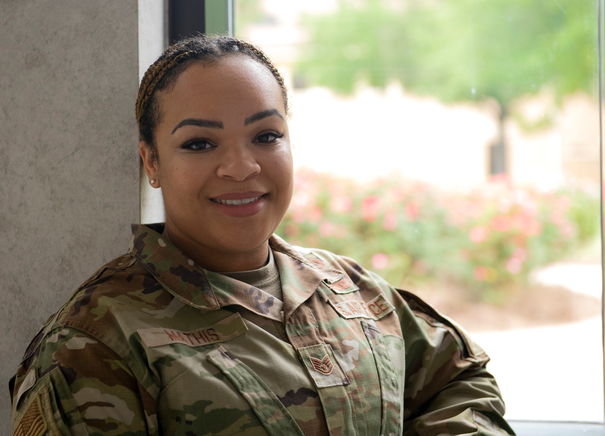 Staff Sgt. Shakira Mathis poses for a photo at Maxwell Air Force Base, Alabama, April 26, 2022. Mathis was able to save a life due to her training in Self Aid Buddy Care.