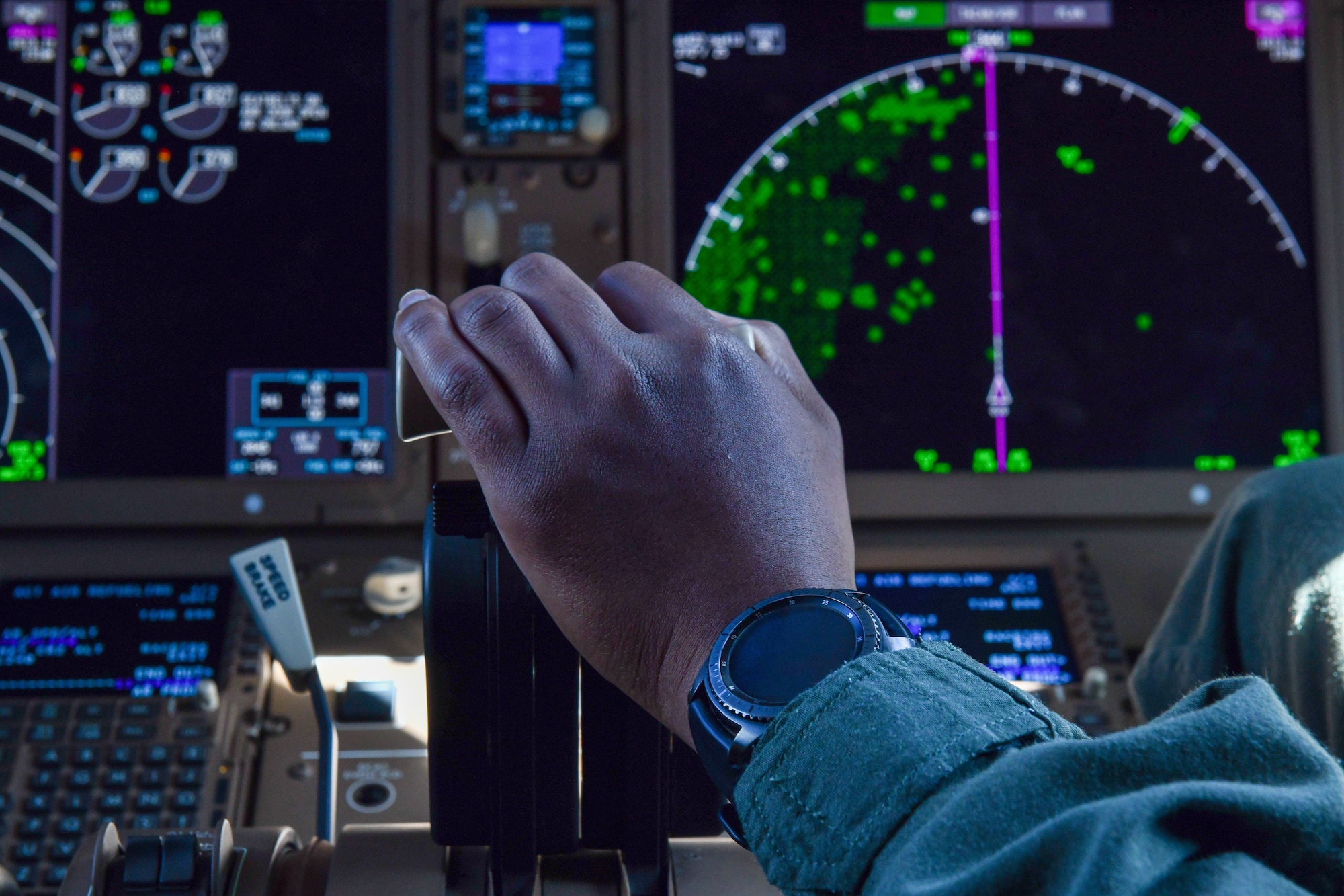 U.S. Air Force Capt. Ryan Smith, 56th Air Refueling Squadron instructor pilot, uses the engine and flaps controller on a KC-46 Pegasus at Altus Air Force Base, Oklahoma, July 22, 2022. The aircraft flew through three states: Kansas, Nebraska and South Dakota (U.S. Air Force photo by Airman 1st Class Miyah Gray)