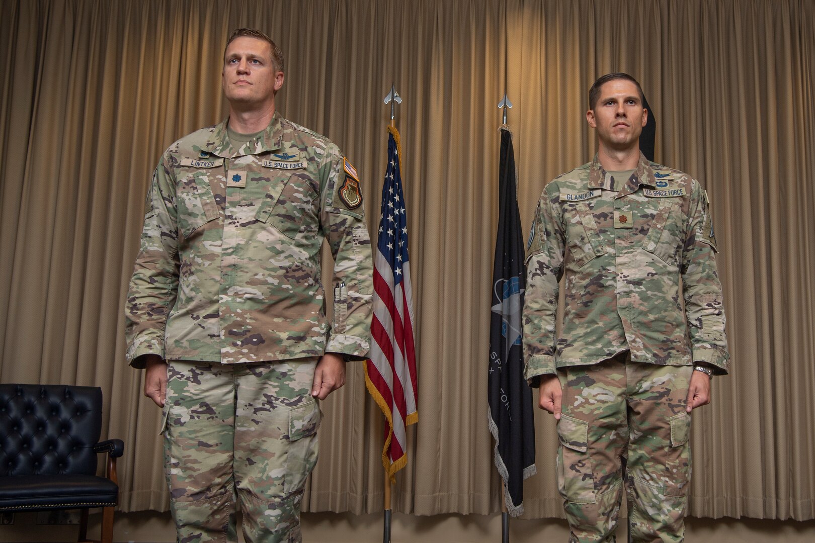 Two military men in uniform standing at attention