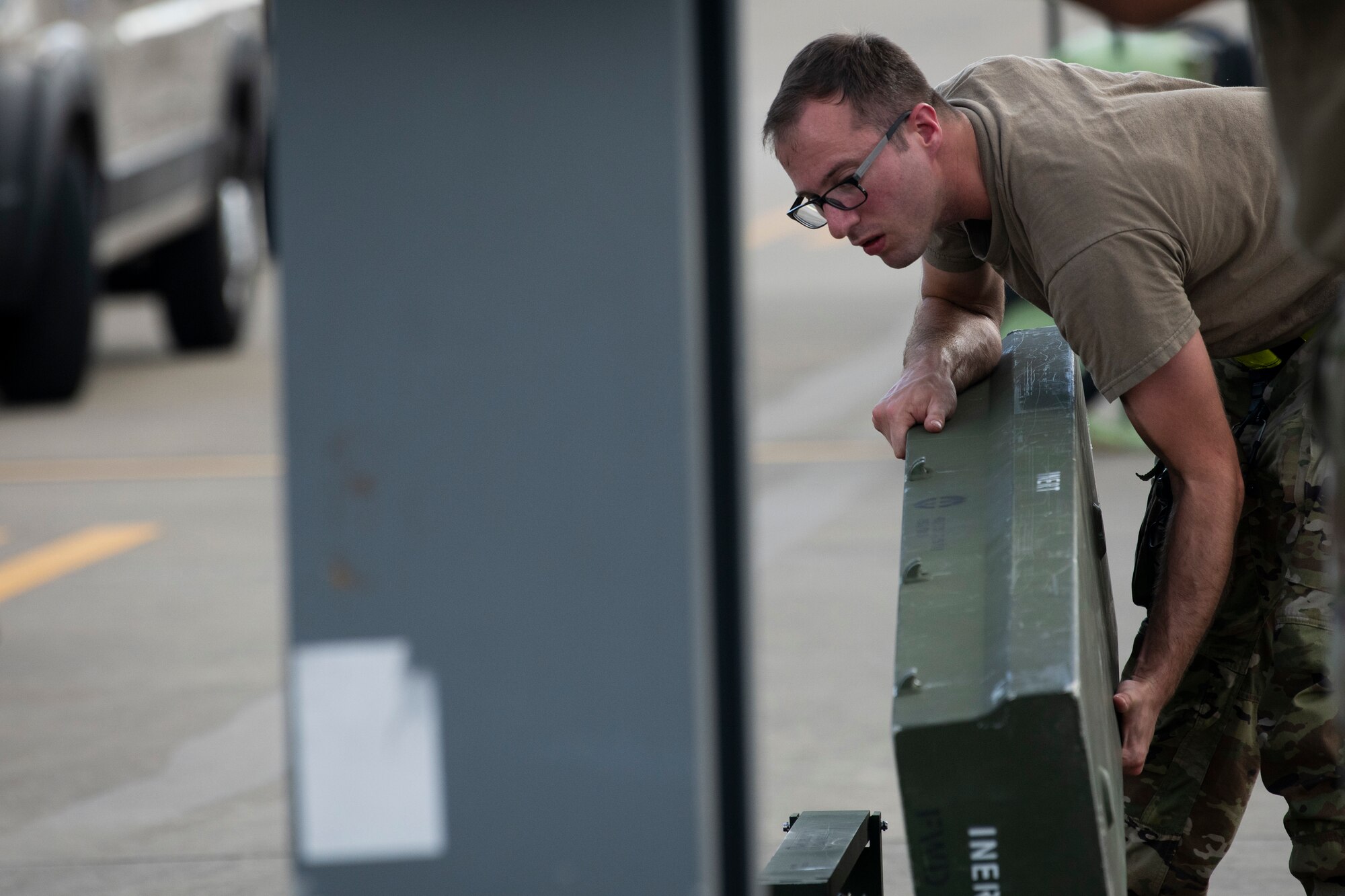 U.S. Air Force Senior Airman Jordan Stout, a 73rd Aircraft Maintenance Unit weapons load crew member, participates in a quarterly load crew competition at Hurlburt Field, Florida, July 8, 2022.