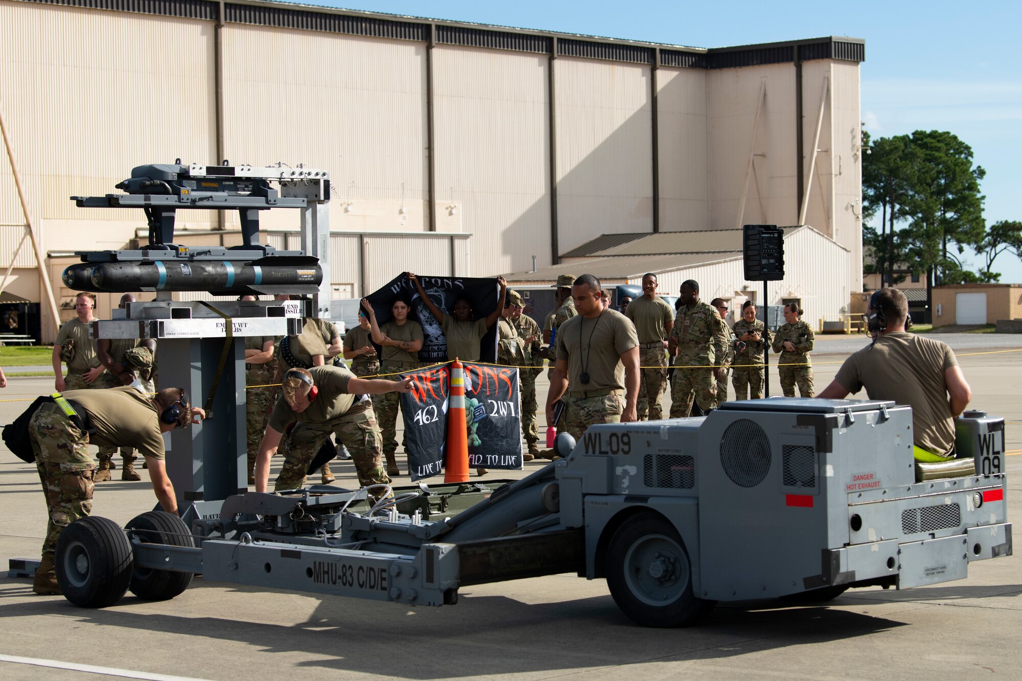 U.S. Air Force Airmen from the 73rd Aircraft Maintenance Unit participate in a quarterly load crew competition at Hurlburt Field, Florida, July 8, 2022.