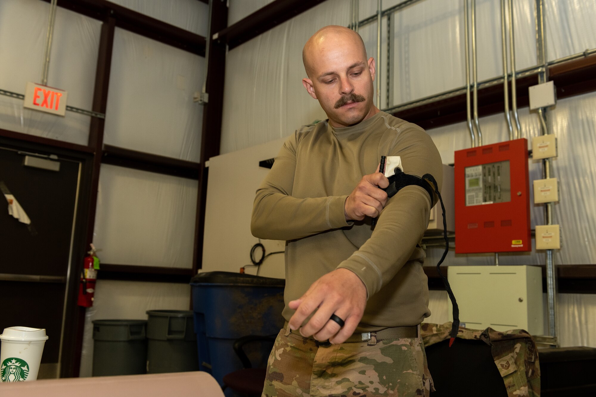 Service member learns how to apply a tourniquet