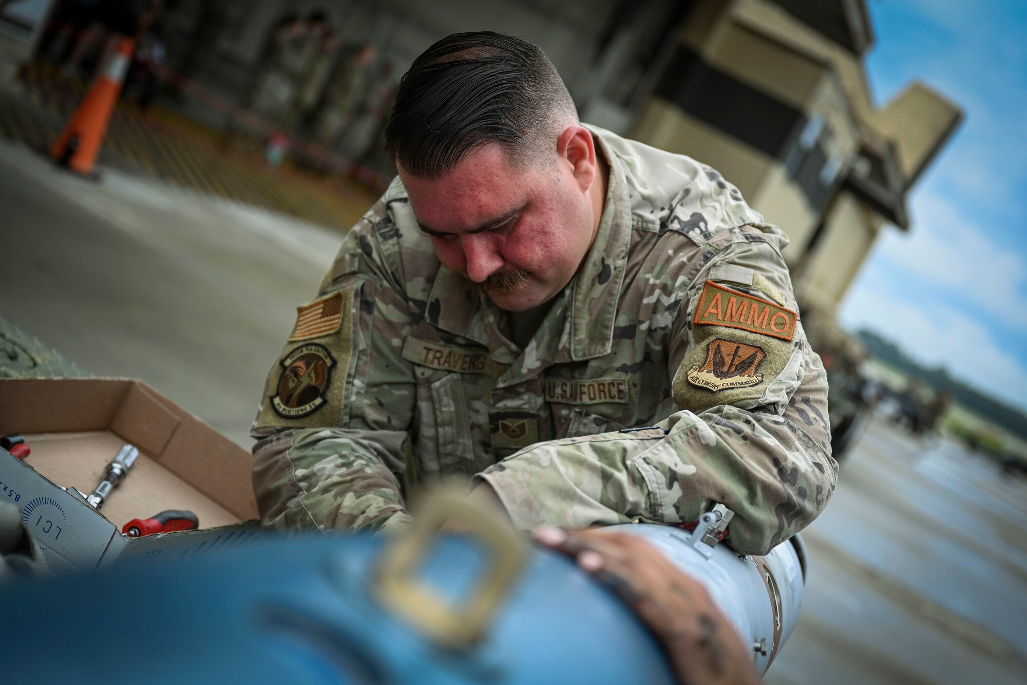 Tech. Sgt. Adam Travers, 4th Munitions Squadron operations shop chief participates in a quarterly load crew competition at Seymour Johnson Air Force Base, North Carolina, July 15, 2022. The competition is held to test the skill and speed of load crews building and loading munitions. (U.S. Air Force photo by Senior Airman David Lynn)