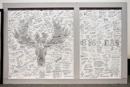 A panel from the 816th Expeditionary Airlift Squadron operations building signed by the Airmen involved with Operation Allies Refuge