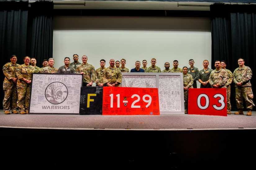 U.S. Air Force and U.K. Royal Air Force personnel donate artifacts from Operation Allies Refuge to the National Museum of the U.S. Air Force at the Air Force Museum.