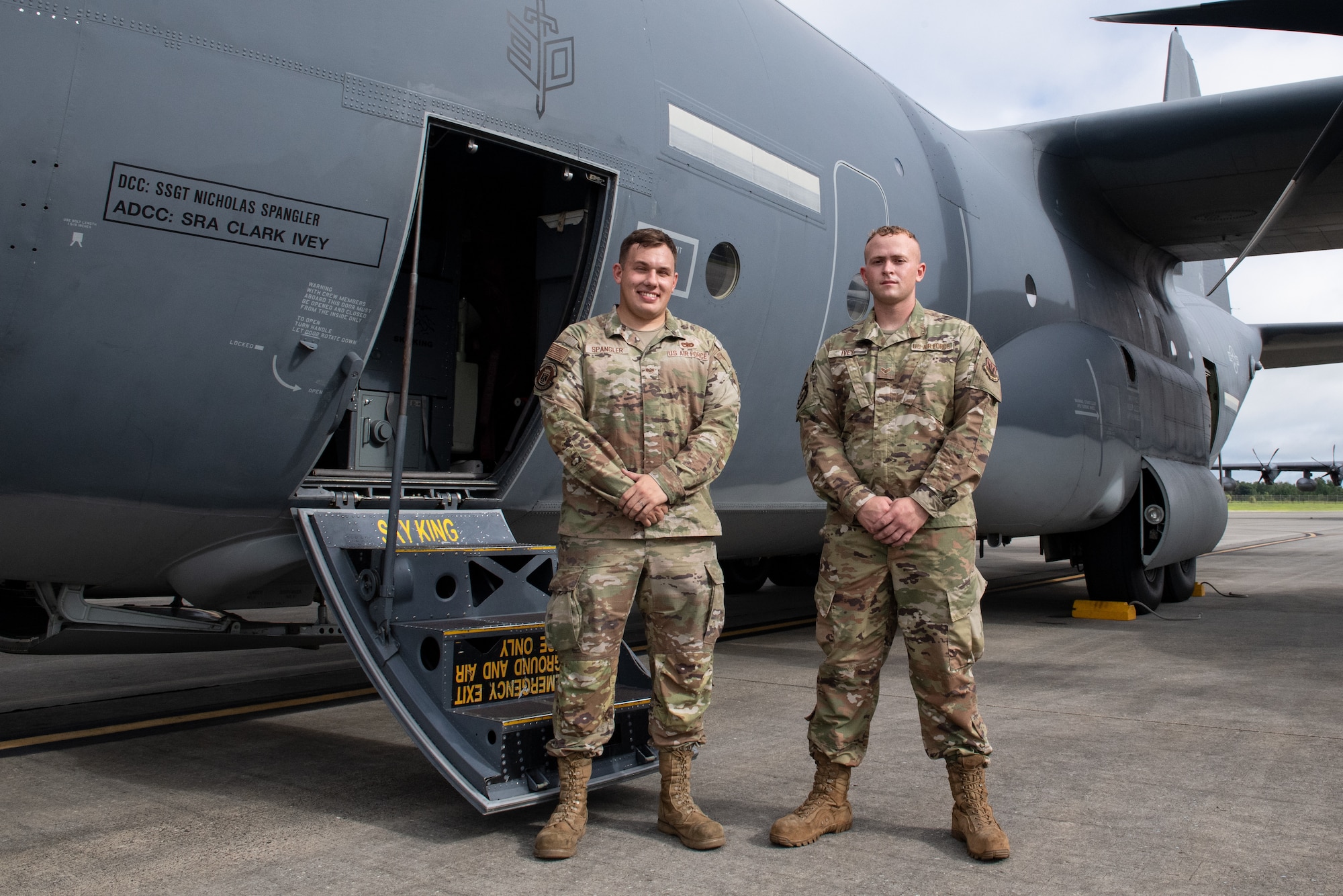 U.S. Air Force Staff Sgt. Nicholas Spangler, 71st Rescue Generation Squadron dedicated crew chief, and Senior Airman Clark Ivey, 71st RGS assistant dedicated crew chief, stand by an HC-130J Combat King II on July 12, 2022, at Moody Air Force Base, Georgia. Spangler and Ivey achieved a defect-free Black Letter flight, a rare occurrence in a maintainer's career. (U.S. Air Force photo by Staff Sgt. John Crampton)