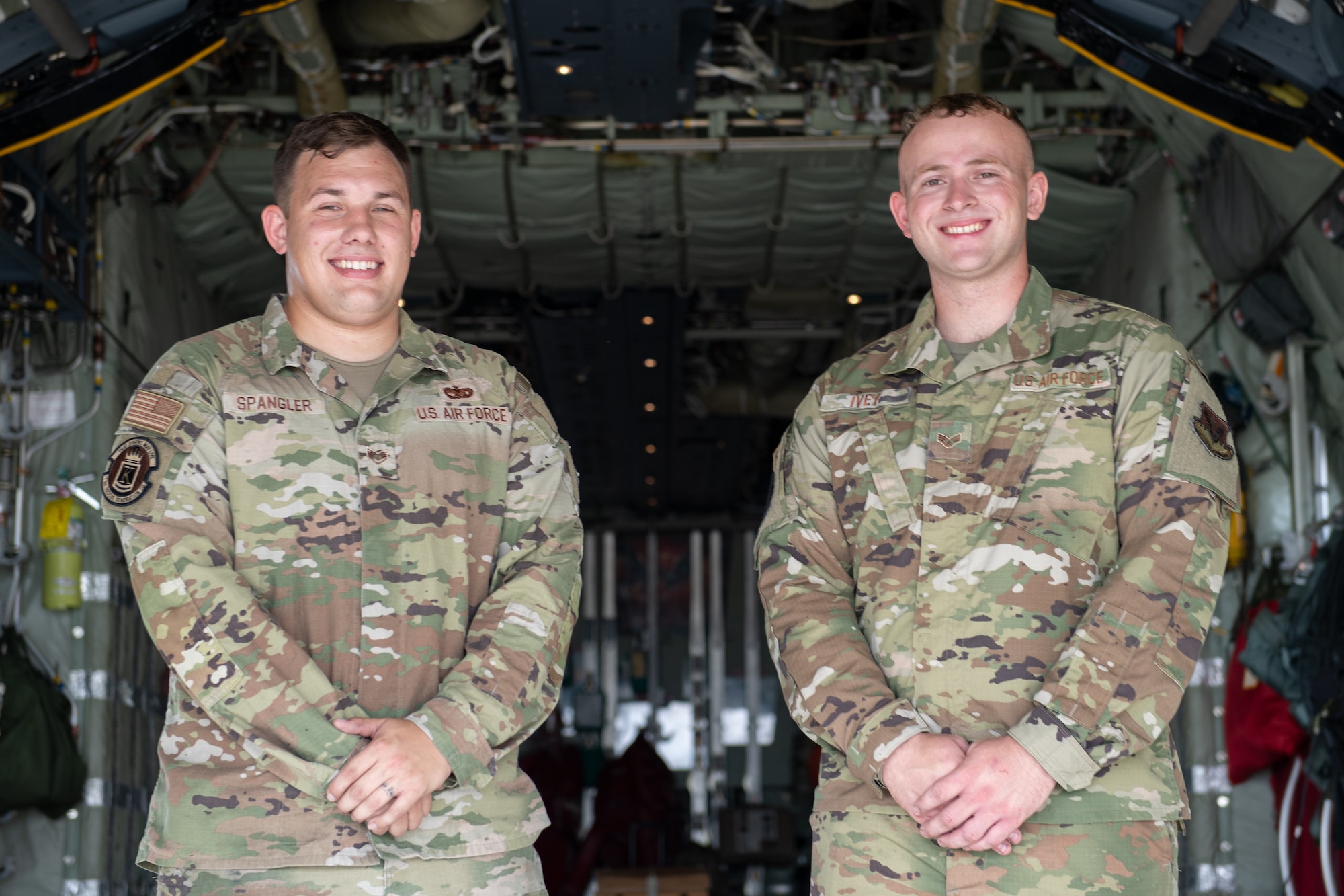 U.S. Air Force Staff Sgt. Nicholas Spangler, 71st Rescue Generation Squadron dedicated crew chief, and Senior Airman Clark Ivey, 71st RGS assistant dedicated crew chief, pose for a photo in an HC-130J Combat King II on July 12, 2022, at Moody Air Force Base, Georgia. Spangler and Ivey eliminated all discrepancies and defects for the aircraft, putting them in exclusive company as Airmen who have achieved a Black Letter flight. (U.S. Air Force photo by Staff Sgt. John Crampton)