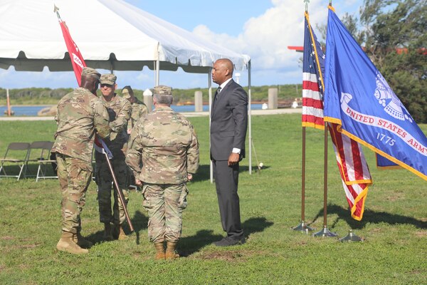 Col. Kenneth Reed (far left) passes the U.S. Army Corps of Engineers (USACE) Galveston District command flag to Col. Rhett Blackmon (second from left) during a change of command ceremony at the Galveston District headquarters, July 15.