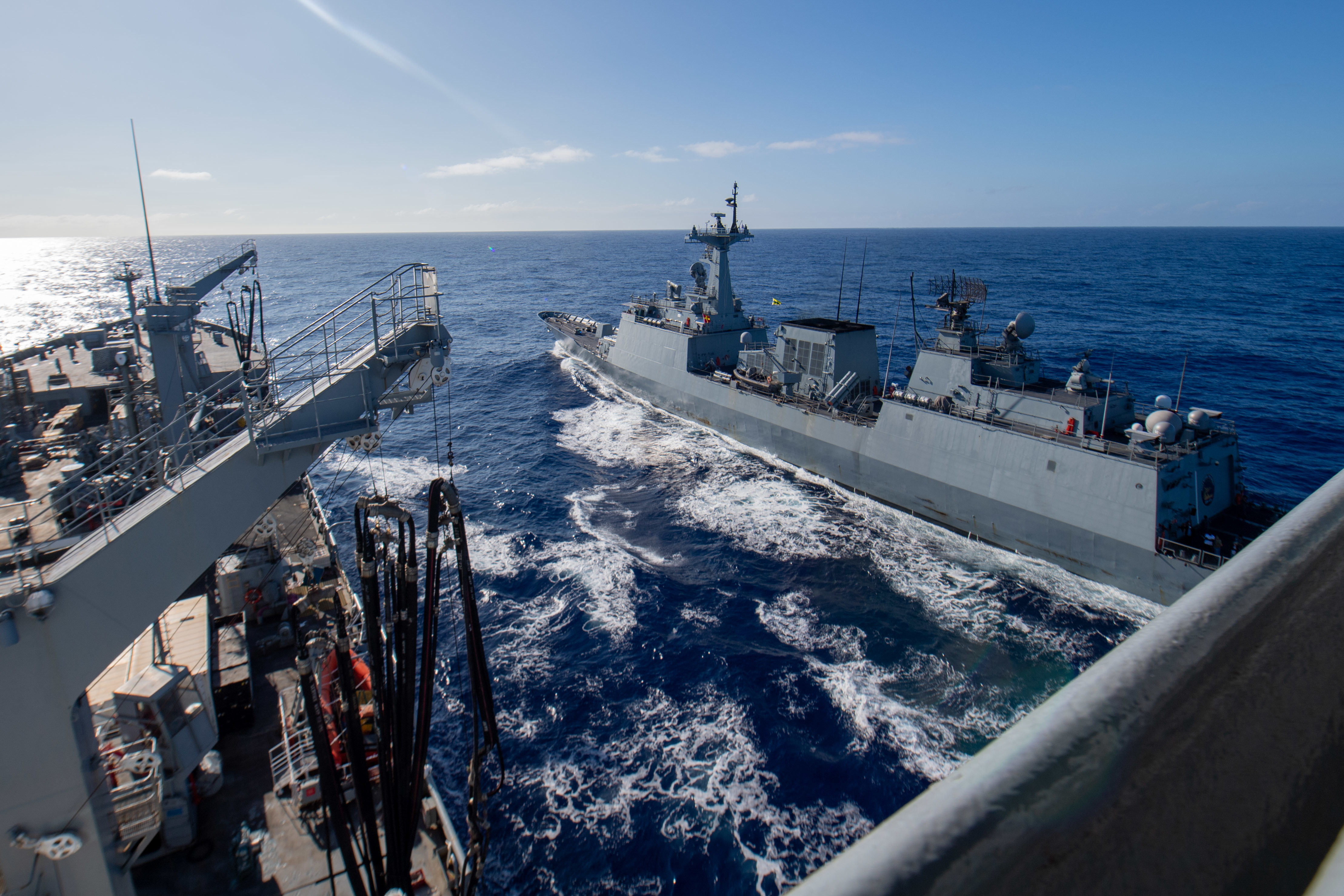 Indonesian Navy frigate KRI I Gusti Ngurah Rai (332) sails alongside Henry J. Kaiser-class fleet replenishment oiler USNS Pecos (T-AO 197) during Rim of the Pacific (RIMPAC) 2022, July 13.