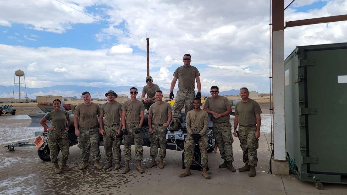 Airmen pose for a photo