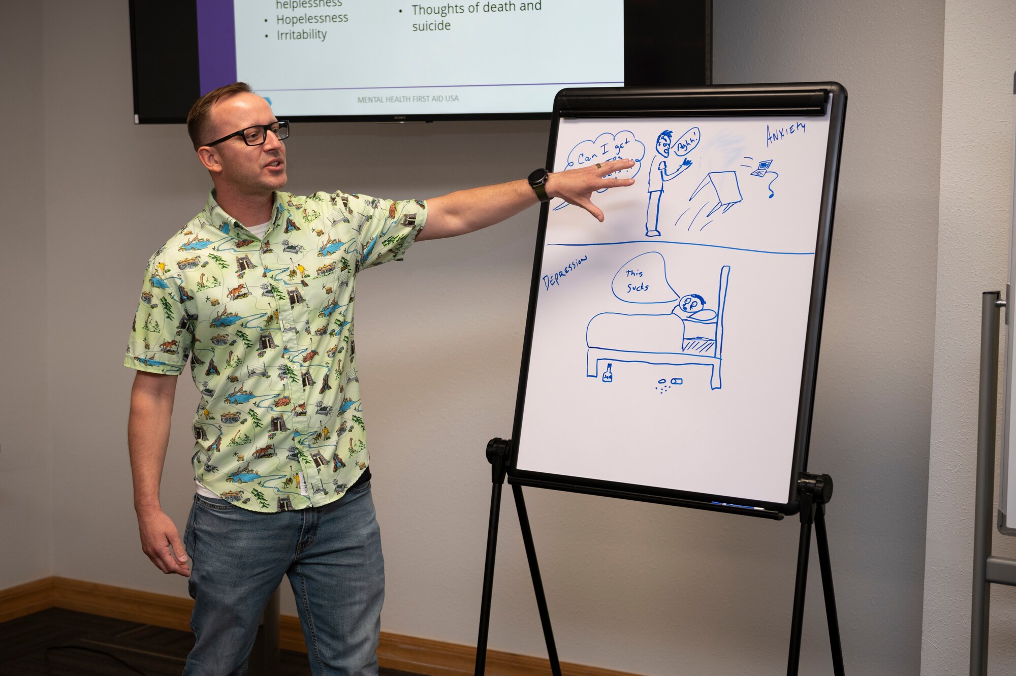 Master Sgt. Mike Rainey, 377th Mission Support Group first sergeant at Kirtland Air Force Base, New Mexico, explains his group’s drawing during an exercise at a Mental Health First Aid course on Holloman AFB, New Mexico, July 14, 2022. Rainey and 19 other first sergeants from Kirtland and Holloman teamed up for the class to hone their skills at identifying, understanding and responding to signs of mental illnesses and substance use disorders. (U.S. Air Force photo by Tech. Sgt. Victor J. Caputo)