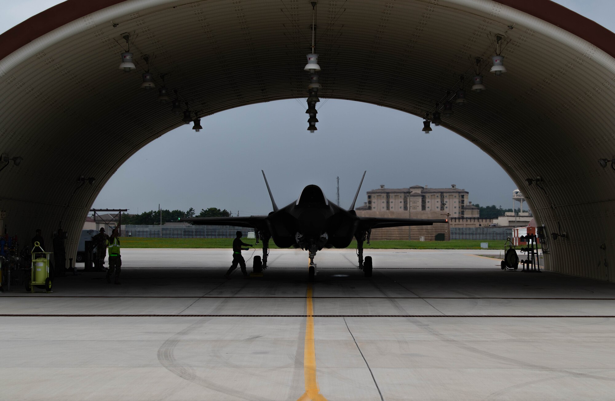An airman from the 8th Logistic Readiness Squadron, grounds an F-35A Lightning II before refueling at Kunsan Air Base, Republic of Korea, July 11, 2022. U.S. Air Force F-35 aircraft from Eielson Air Force Base, Alaska arrived in the Republic of Korea to conduct training flights with ROKAF to enhance
interoperability between the two Air Forces on and around the Korean Peninsula. (U.S. Air Force photo by Senior Airman Shannon Braaten)