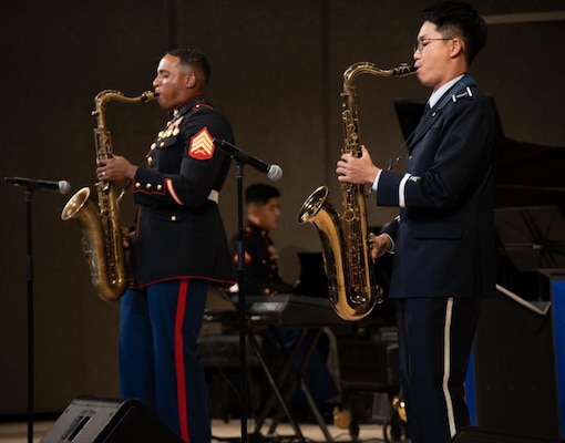 U.S. Marine Corps Sgt. Erik Wright, a member of the III Marine Expeditionary Force Band performs a saxophone duet with Japan Air Self-Defense Force Airman 1st Class Ren Watanabe, a member of the Southwestern Air Defense Force Band, during a joint big band jazz concert at the Naha Cultural Arts Theater, Naha, Okinawa, Japan, July 10, 2022. The purpose of the concert was to show Tomo Ni, a Japanese phrase for togetherness, describing the relationship with allies, standing together in defense of shared values, peace, and a free and open Indo-Pacific.
(U.S. Marine Corps photo by Sgt. Marcos A. Alvarado)