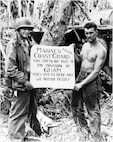 This iconic image from the Battle of Guam testifies to the strong bonds forged between the Marine Corps and the Coast Guard over the course of the Pacific War. (Courtesy of the Coast Guard)