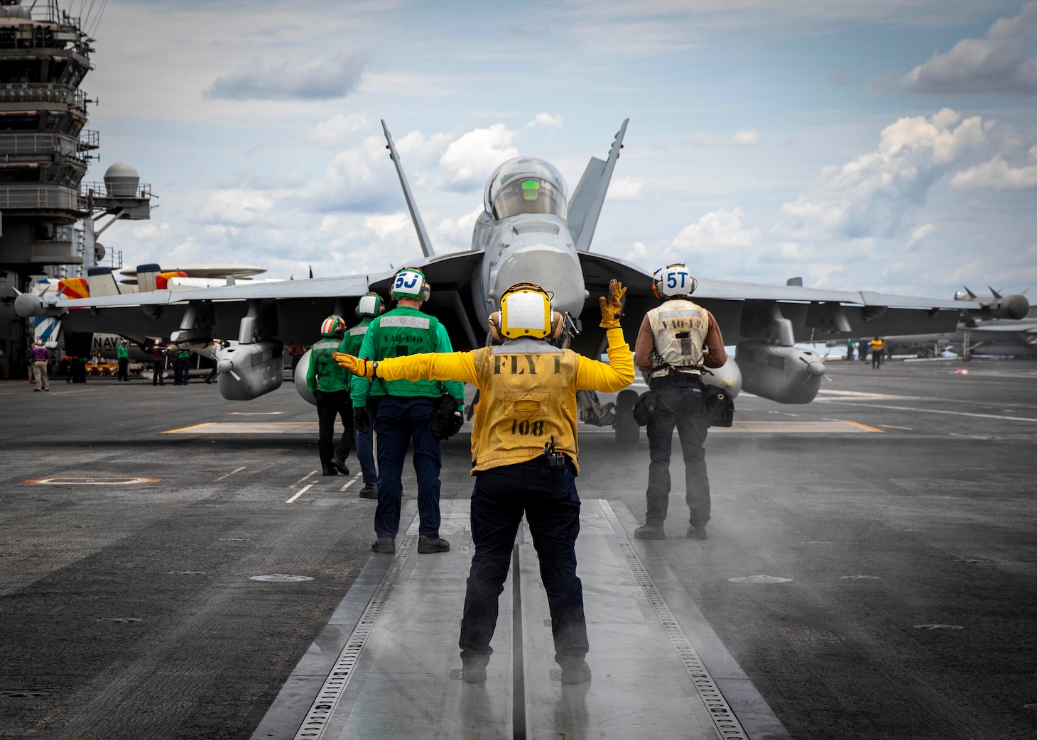 An E/A-18G Growler aircraft, attached to Electronic Attack Squadron (VAQ) 140, moves to a catapult on the flight deck of the Nimitz-class aircraft carrier USS George H.W. Bush (CVN 77), June 21, 2022.