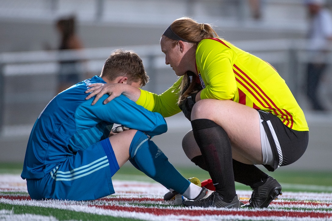 Air Force Lt. Jen Hiddink of the U.S. Armed Forces Women’s Soccer Team, right, comforts Germany’s goal keeper Gina-Marie Mitschke after the US team wins 2-1  during the the 13th CISM (International Military Sports Council) World Military Women’s Football Championship in Meade, Washington July 15, 2022. (DoD photo by EJ Hersom)