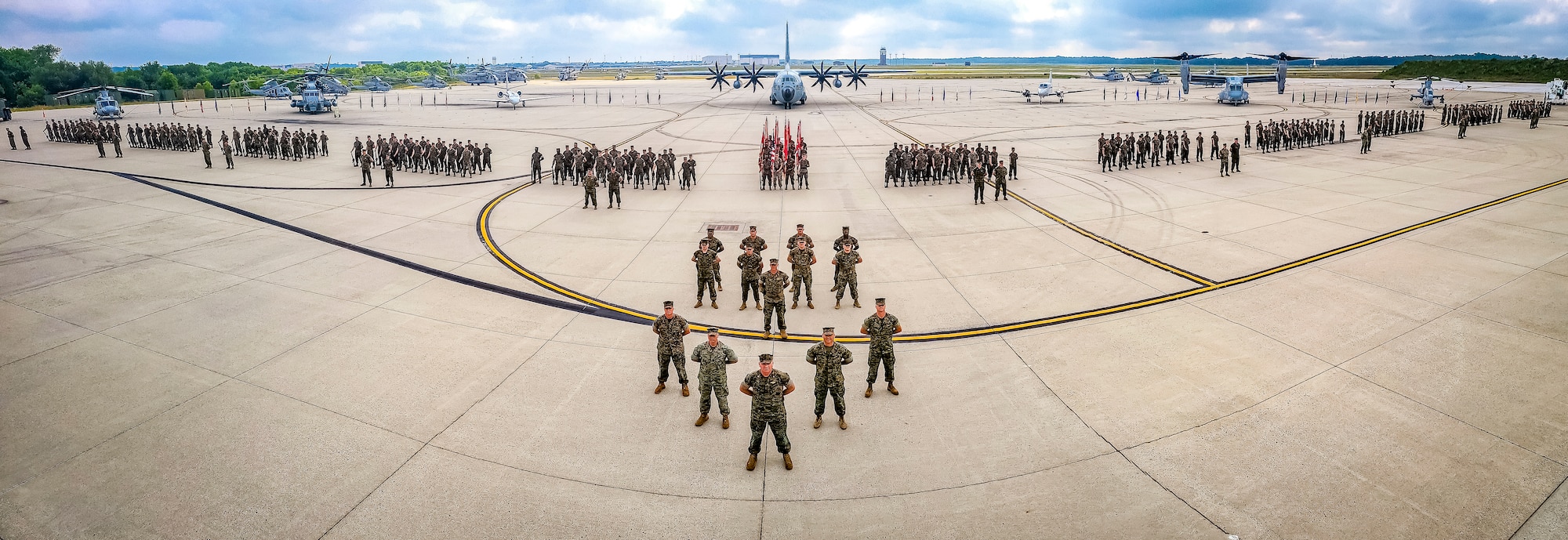 U.S. Marines assigned to Marine Aircraft Group 49 pose for a group photo on July 16, 2022 at Joint Base McGuire Dix Lakehurst. The mission of MAG 49 is to organize, train, and equip combat ready squadrons to augment and reinforce the active Marine forces in time of war, national emergency, or contingency operations, and to provide personnel and assault support capabilities to relieve operational tempo for active duty forces. (U.S. Air Force Photo by Senior Airman Matt Porter)