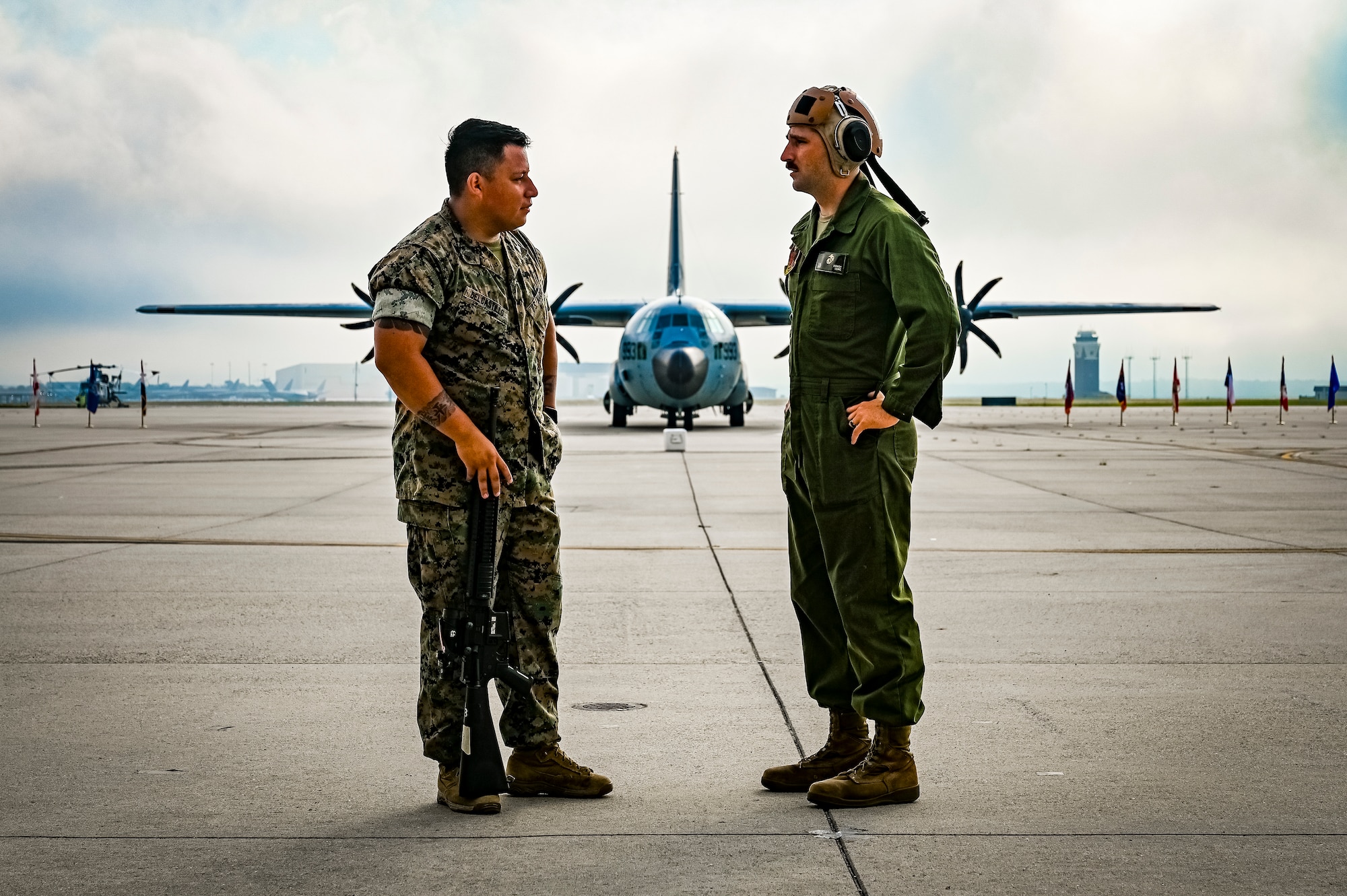 U.S. Marines assigned to Marine Aircraft Group 49 pose for a photo on July 16, 2022 at Joint Base McGuire Dix Lakehurst. The mission of MAG 49 is to organize, train, and equip combat ready squadrons to augment and reinforce the active Marine forces in time of war, national emergency, or contingency operations, and to provide personnel and assault support capabilities to relieve operational tempo for active duty forces. (U.S. Air Force Photo by Senior Airman Matt Porter)