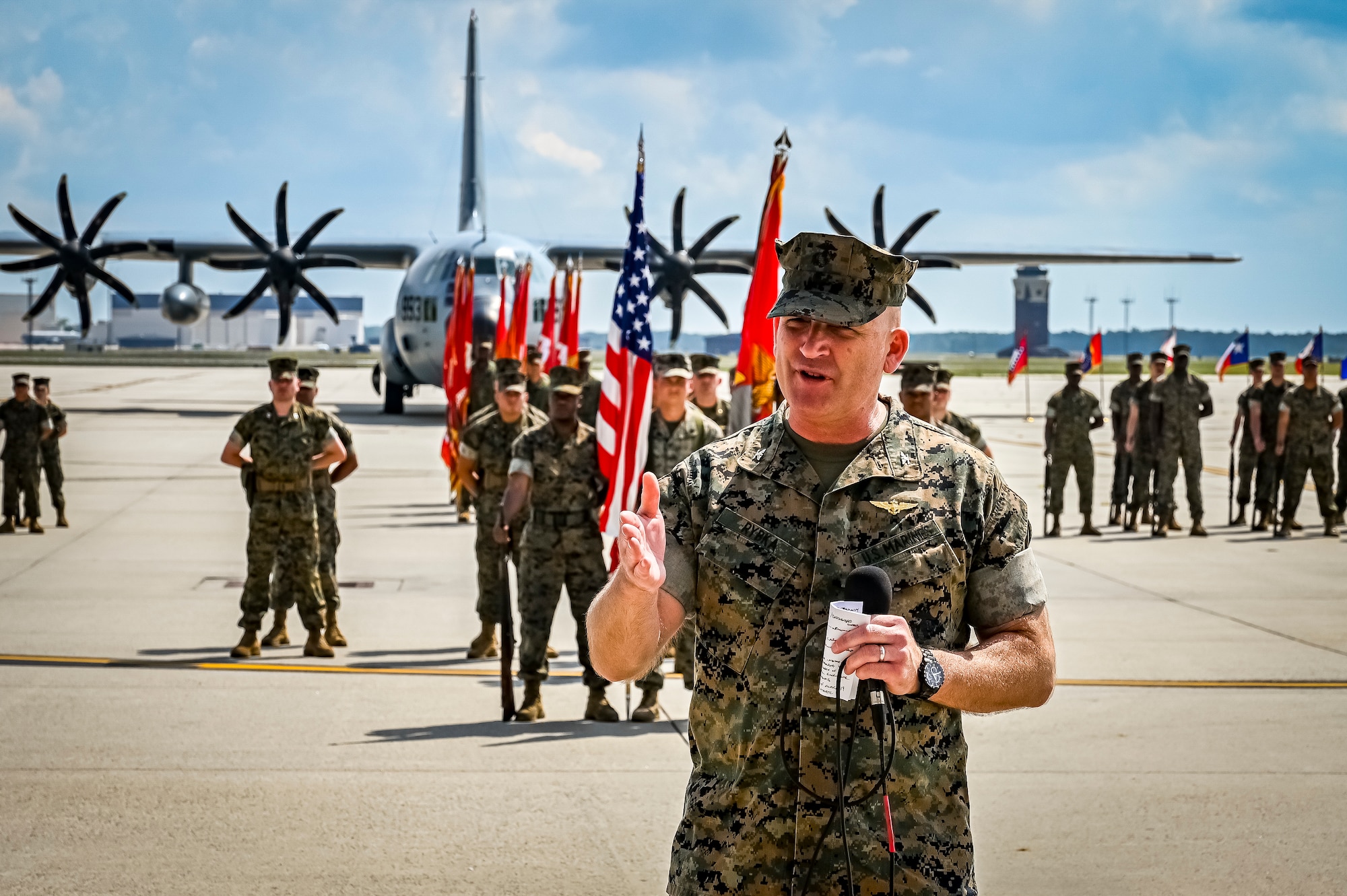 U.S. Marine Corps. Col. Russell Rybka, Marine Aircraft Group commander, speaks to an audience as part of a change of command ceremony on July 16, 2022 at Joint Base McGuire Dix Lakehurst. The change of command ceremony is a military tradition that represents a formal transfer of authority and responsibility for a unit from one officer to another. The mission of MAG 49 is to organize, train, and equip combat ready squadrons to augment and reinforce the active Marine forces in time of war, national emergency, or contingency operations, and to provide personnel and assault support capabilities to relieve operational tempo for active duty forces. (U.S. Air Force Photo by Senior Airman Matt Porter)