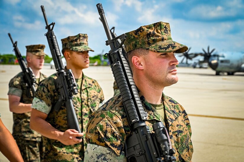 U.S. Marines assigned to Marine Aircraft Group 49 parade march as part of a change of command ceremony on July 16, 2022 at Joint Base McGuire Dix Lakehurst. The change of command ceremony is a military tradition that represents a formal transfer of authority and responsibility for a unit from one officer to another. The mission of MAG 49 is to organize, train, and equip combat ready squadrons to augment and reinforce the active Marine forces in time of war, national emergency, or contingency operations, and to provide personnel and assault support capabilities to relieve operational tempo for active duty forces. (U.S. Air Force Photo by Senior Airman Matt Porter)