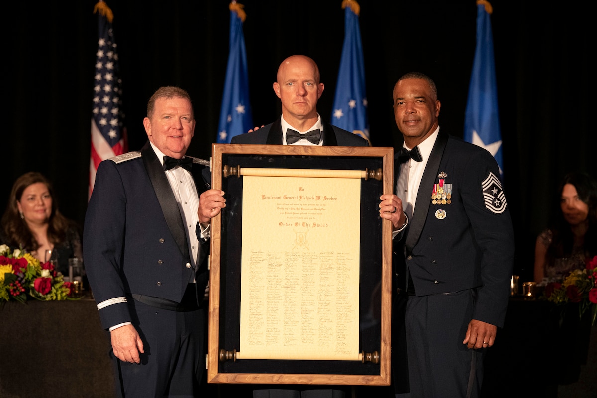 Photo of Lt. Gen. Richard W. Scobee (left), Chief of the Air Force Reserve and Commander of the Air Force Reserve Command, was presented the official Air Force Order of the Sword scroll at a ceremony held in Washington, D.C., July 12, 2022.