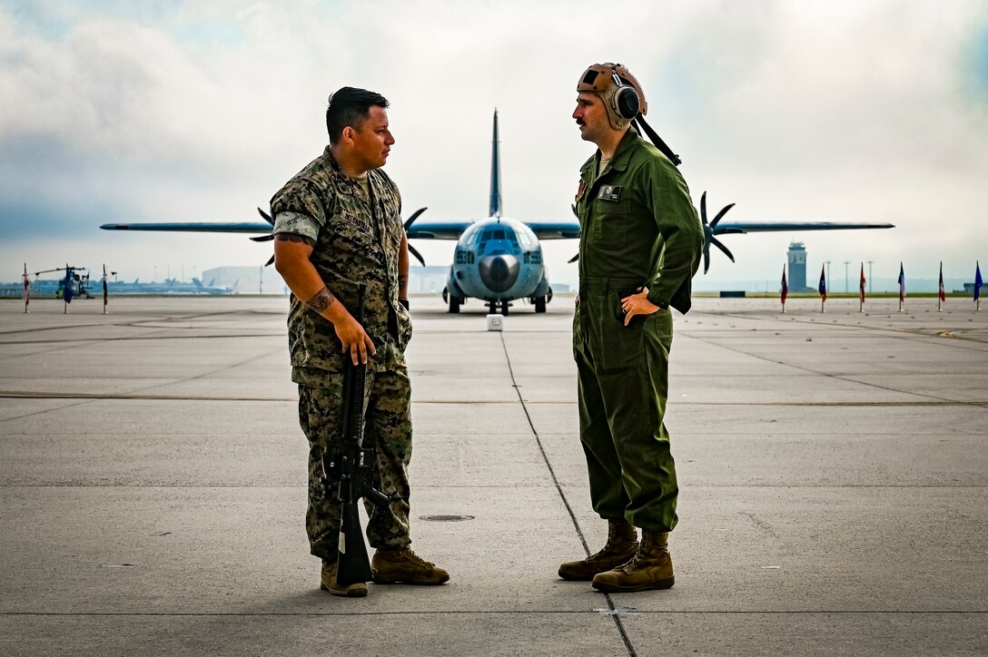 U.S. Marines assigned to Marine Aircraft Group 49 pose for a photo on July 16, 2022 at Joint Base McGuire Dix Lakehurst. The mission of MAG 49 is to organize, train, and equip combat ready squadrons to augment and reinforce the active Marine forces in time of war, national emergency, or contingency operations, and to provide personnel and assault support capabilities to relieve operational tempo for active duty forces. (U.S. Air Force Photo by Senior Airman Matt Porter)