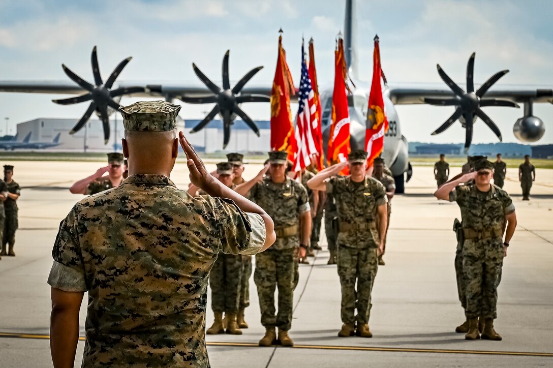 U.S. Marine Corps. Col. Lonnie Cobb, Marine Aircraft Group commander, salutes marines as part of a change of command ceremony on July 16, 2022 at Joint Base McGuire Dix Lakehurst. The change of command ceremony is a military tradition that represents a formal transfer of authority and responsibility for a unit from one officer to another. The mission of MAG 49 is to organize, train, and equip combat ready squadrons to augment and reinforce the active Marine forces in time of war, national emergency, or contingency operations, and to provide personnel and assault support capabilities to relieve operational tempo for active duty forces. (U.S. Air Force Photo by Senior Airman Matt Porter)
