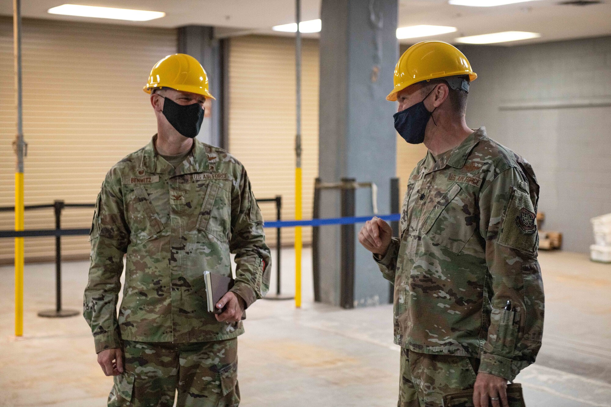 Two commanders meet in a room under construction