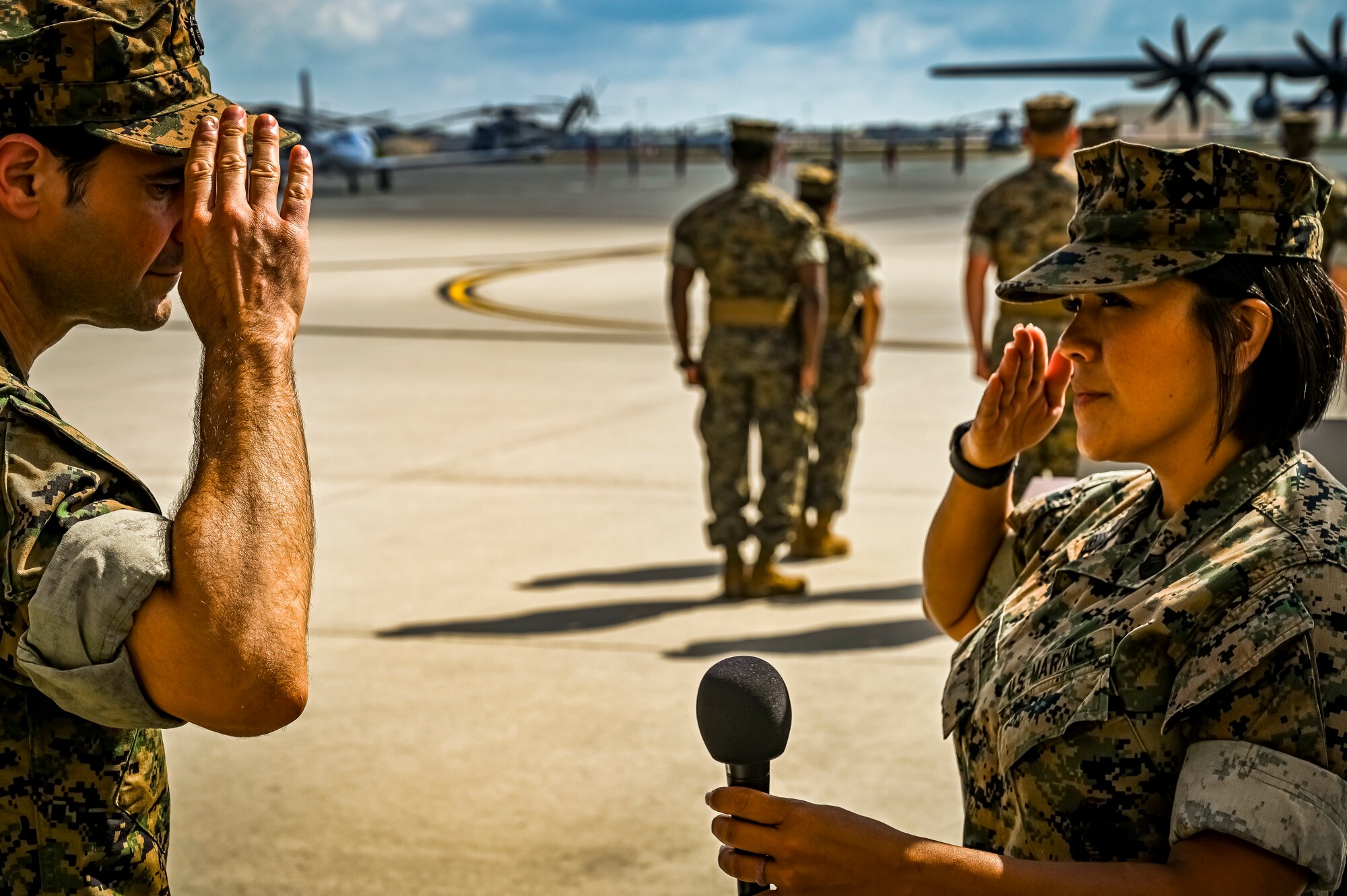 U.S. Marine Corps. Gunnery Sgt. Felicia Valadez, Marine Aircraft Group 49 ordinance specialist, renders a salute to Lt. Cmdr. Issac Comrov, Marine Aircraft Group 49 chaplain, during a relief a appointment retirement ceremony on July 17, 2022 at Joint Base McGuire Dix Lakehurst, N.J. The relief and appointment is a military tradition that represents a formal transfer of authority and responsibility for a unit from one senior noncommissioned officer to another. The mission of MAG 49 is to organize, train, and equip combat ready squadrons to augment and reinforce the active Marine forces in time of war, national emergency, or contingency operations, and to provide personnel and assault support capabilities to relieve operational tempo for active duty forces. (U.S. Air Force Photo by Senior Airman Matt Porter)