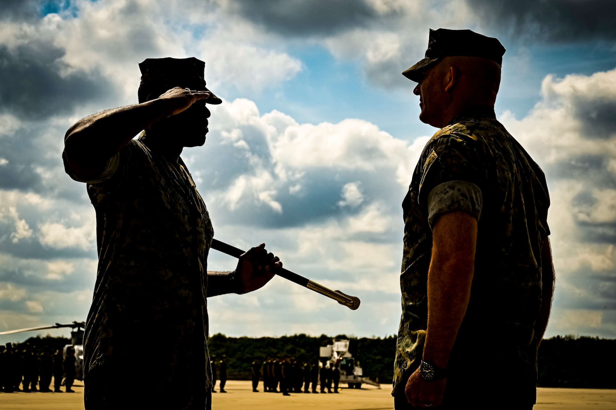 U.S. Marine Corps. Sg. Maj. William Singleton, Marine Aircraft Group 49 sergeant major, renders a salute to U.S. Marine Corps. Col. Russell Rybka, Marine Aircraft Group 49 commander, during a relief and appointment retirement ceremony on July 17, 2022 at Joint Base McGuire Dix Lakehurst, N.J. The relief and appointment is a military tradition that represents a formal transfer of authority and responsibility for a unit from one senior noncommissioned officer to another. The mission of MAG 49 is to organize, train, and equip combat ready squadrons to augment and reinforce the active Marine forces in time of war, national emergency, or contingency operations, and to provide personnel and assault support capabilities to relieve operational tempo for active duty forces. (U.S. Air Force Photo by Senior Airman Matt Porter)