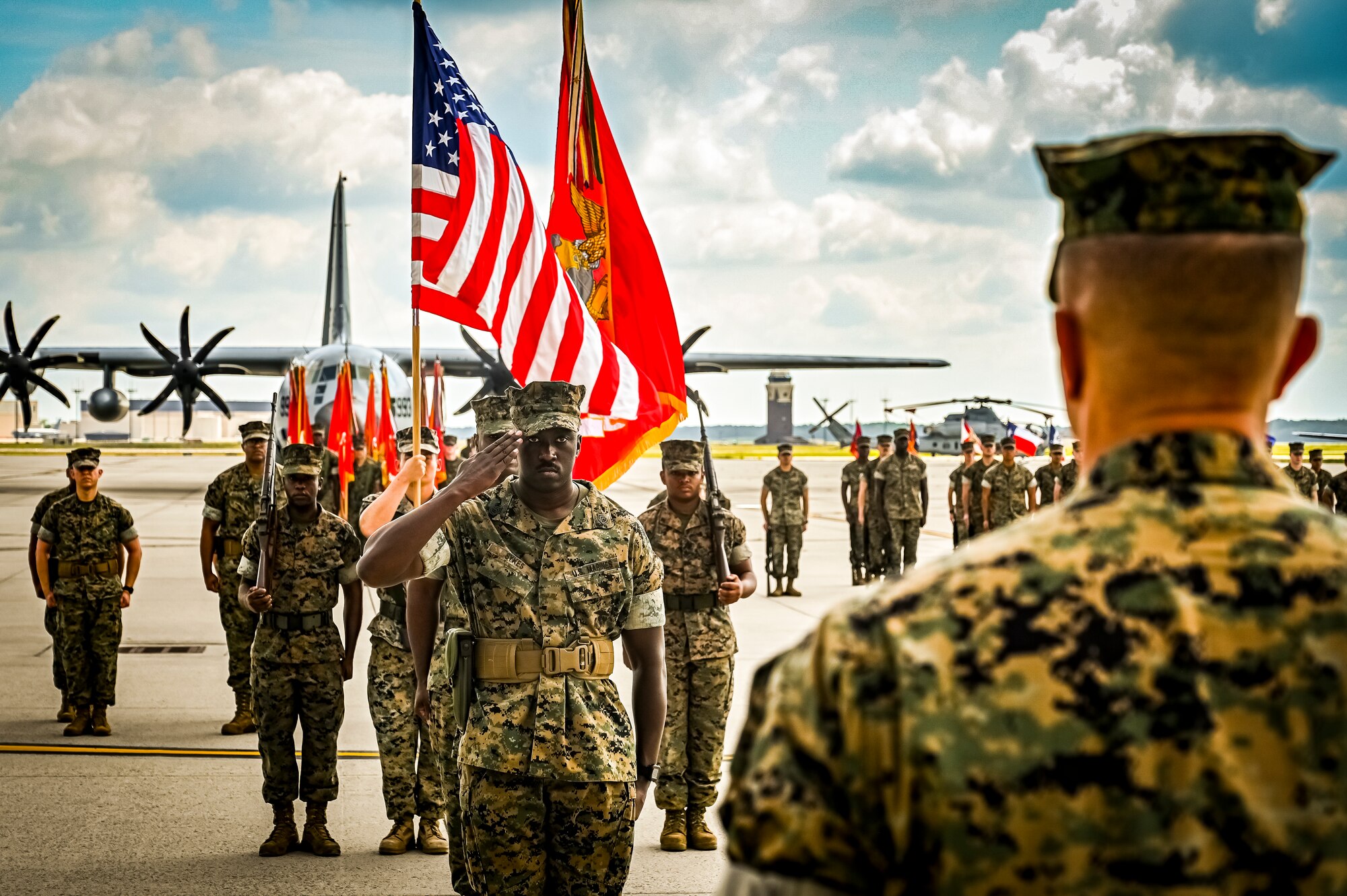 U.S. Marine Corps. Gunnery Sgt. Sykes, Marine Aircraft Group 49 ordinance specialist, renders a salute to U.S. Marine Corps. Brig. Gen. Leonard Anderson, 4th Marine Aircraft Wing commander, during a relief a appointment retirement ceremony on July 17, 2022 at Joint Base McGuire Dix Lakehurst, N.J. The relief and appointment is a military tradition that represents a formal transfer of authority and responsibility for a unit from one senior noncommissioned officer to another. The mission of MAG 49 is to organize, train, and equip combat ready squadrons to augment and reinforce the active Marine forces in time of war, national emergency, or contingency operations, and to provide personnel and assault support capabilities to relieve operational tempo for active duty forces. (U.S. Air Force Photo by Senior Airman Matt Porter)
