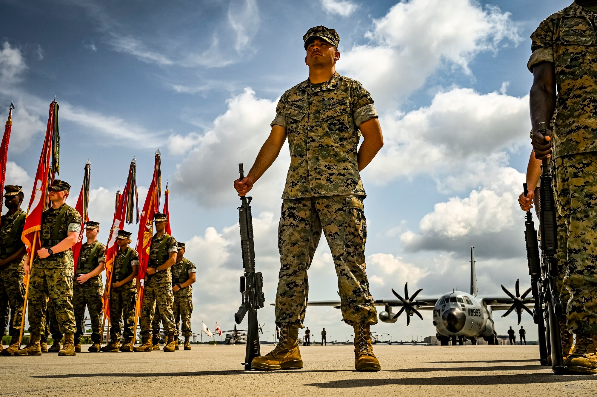 U.S. Marine Corps. marines assigned to Marine Aircraft Group 49 stand at parade rest during a relief and appointment retirement ceremony on July 17, 2022 at Joint Base McGuire Dix Lakehurst, N.J. The relief and appointment is a military tradition that represents a formal transfer of authority and responsibility for a unit from one senior noncommissioned officer to another. The mission of MAG 49 is to organize, train, and equip combat ready squadrons to augment and reinforce the active Marine forces in time of war, national emergency, or contingency operations, and to provide personnel and assault support capabilities to relieve operational tempo for active duty forces. (U.S. Air Force Photo by Senior Airman Matt Porter)