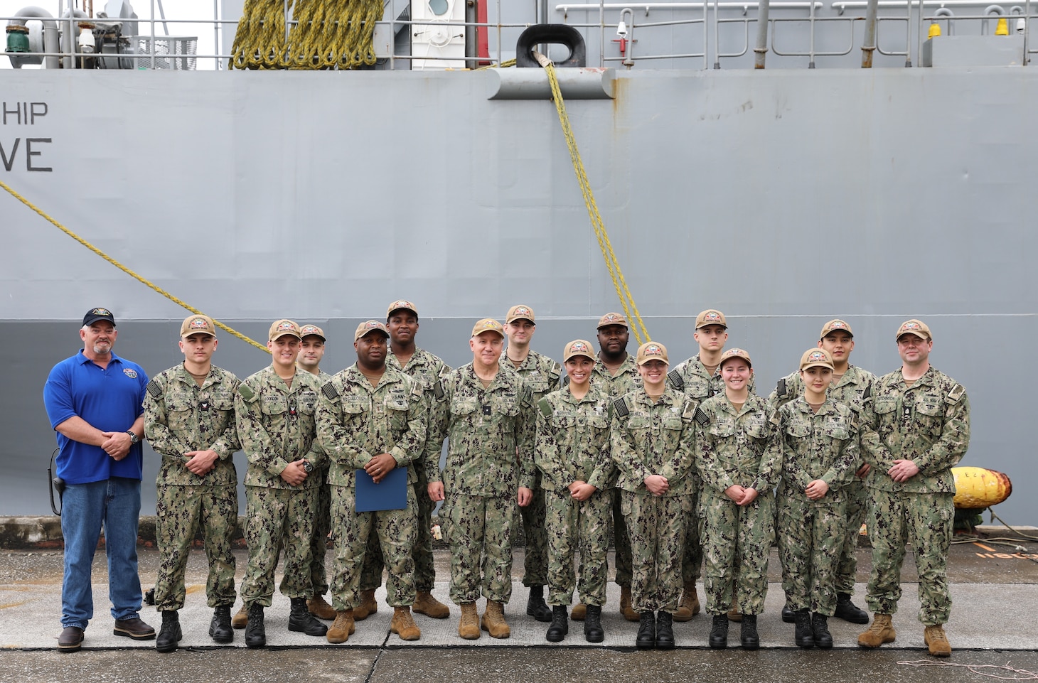 YOKOHAMA, Japan (July 13, 2022) Rear Adm. Rick Seif, commander, Submarine Group 7/Task Force 74, center, and Mr. Robert Swinburne, ship’s master, pose for a photo with Sailors from Naval Ocean Processing Facility, Whidbey Island, July 13, 2022. Submarine Group 7 directs forward-deployed, combat capable forces across the full spectrum of undersea warfare throughout the Western Pacific, Indian Ocean and Arabian Sea. (U.S. Navy photo by Lt. Cmdr. Rob Reinheimer)