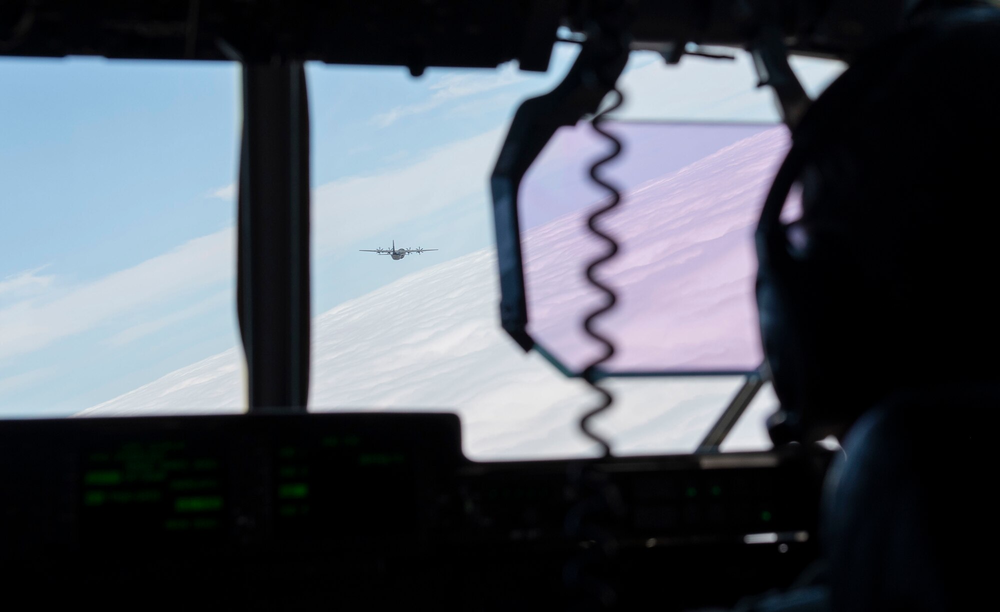 A C-130J Super Hercules flies over Japan