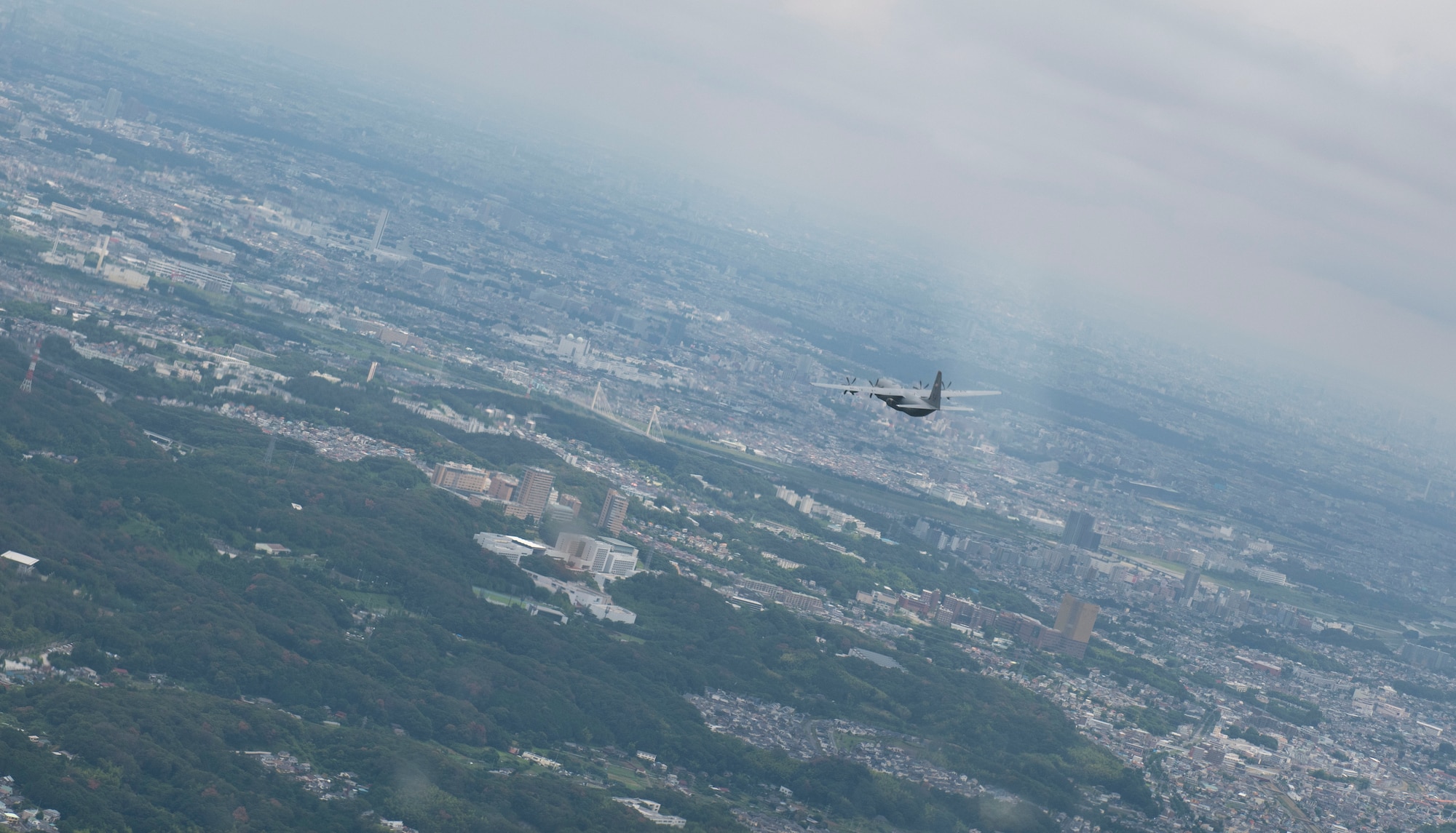 A C-130J Super Hercules assigned to the 36th Airlift Squadron flies over Japan